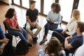 Female Tutor Leading Discussion Group Amongst High School Pupils Royalty Free Stock Photo