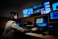 Female TV director control editing room in television studio.Operating vision mixer console equipment in a broadcast panel gallery