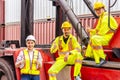 Female worker and two male workers wearing yellow safety vests. Royalty Free Stock Photo