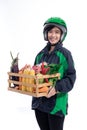 Female uber delivery wearing helmet bring groceries