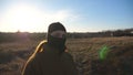 Female ukrainian army soldier standing at field and looking at camera. Serious sight of woman in military camouflage