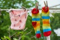 female underwear and socks air drying on the clothes line outside in the backyard