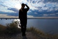 Female in uniform saluting outdoors. Military service