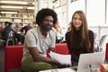 Female University Student Working In Library With Tutor Royalty Free Stock Photo