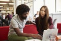 Female University Student Working In Library With Tutor Royalty Free Stock Photo