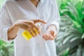 Female using alcohol antiseptic gel to cleaning hand