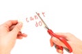 Female using scissors to remove the word can't to read I can do Royalty Free Stock Photo