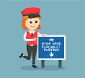 Female valet service standing with parking sign Royalty Free Stock Photo