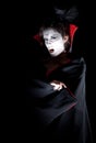 Female vampire showing fangs Royalty Free Stock Photo