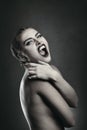 Female vampire showing fangs Royalty Free Stock Photo