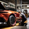 female vehicle technician buffing and detailing an a car