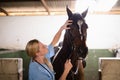 Female vet checking horse