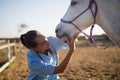 Female vet examining horse mouth