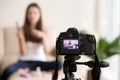 Female video beauty blogger recording vlog