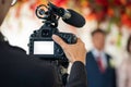 Female Videographer in backside are shooing and recording video in Wedding Event Royalty Free Stock Photo