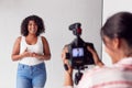 Female Videographer Recording Woman Recording Podcast In Studio Royalty Free Stock Photo