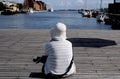 FEMALE VIEW COPENHAGEN HABOUR IN DENMARK