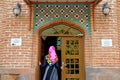 Female Visitor Entering the Prayer Room of the Mosque with Hair Covering