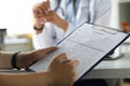 Female visitor filling out medicine documents Royalty Free Stock Photo