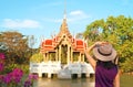 Female Visitor Impressed by a Thai Ancient Style Pavilion on the Lotus Pond of Suanluang King Rama IX Park, Bangkok Royalty Free Stock Photo