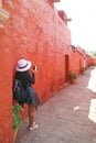 Female Visitor Photographing the Narrow Path in Monastery of Santa Catalina de Siena, Historical Centre of the City of Arequipa,