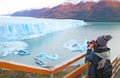 Female Visitor Shooting Photos of Perito Moreno Glacier, an Incredible UNESCO World Heritage Site in Patagonia, Argentina