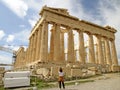 Female Visitor Taking Photo of the Parthenon Ancient Greek Temple at the Hilltop of Acropolis, Athens, Greece Royalty Free Stock Photo