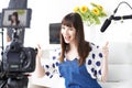 Female Vlogger Recording Broadcast At Home