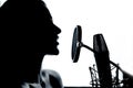 Female vocalist performing music in front of the microphone in the recording studio Royalty Free Stock Photo