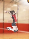 Female volleyball players jumping close-up on vollayball court. Royalty Free Stock Photo