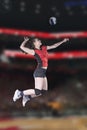 Female volleyball players jumping close-up on vollayball court. Royalty Free Stock Photo