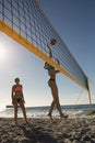 Female volleyball players playing on the beach Royalty Free Stock Photo