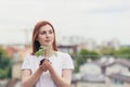 Female volunteer holds in her hands a seedling of a flower tree Royalty Free Stock Photo