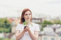 Female volunteer holds in her hands a seedling of a flower tree Royalty Free Stock Photo