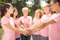 Female Volunteers Supporting Breast Cancer Patients Holding Hands In Park Royalty Free Stock Photo
