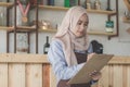 Female waiter in apron writing order Royalty Free Stock Photo