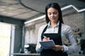 Female waiter in apron writing order Royalty Free Stock Photo