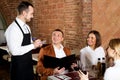 Female waiter in country restaurant