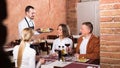 Female waiter in country restaurant