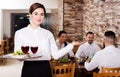 Female waiter showing country restaurant Royalty Free Stock Photo