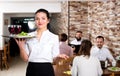 Female waiter showing country restaurant Royalty Free Stock Photo