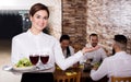 Female waiter showing country restaurant Royalty Free Stock Photo