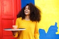 Female waitress with tray in a coffeeshop