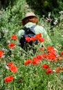 Female walker in a field of wildflowers.