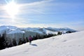 Female walking and admiring the landscapers from the Rodna mountains on a cold winter day Royalty Free Stock Photo