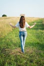 Female walking while balancing books on head