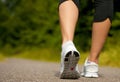 Female walking outdoors in running shoes Royalty Free Stock Photo