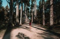 Female walking on a road in a park