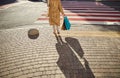 Female walking through the street with shopping bags in hand Royalty Free Stock Photo