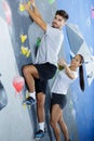 female wall climbing instructor giving instructions